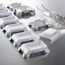 Box of 12 Archimedes ceramic-coated base molds for consumables, 9x9 mm, used in diagnostic laboratory applications.