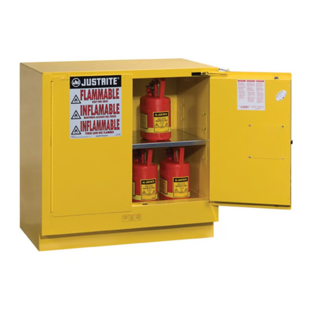 Yellow Justrite flammable safety cabinet made of 22-gauge steel, shown closed for secure storage of hazardous materials.
