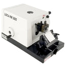 Refurbished Leica RM2025 Microtome equipment with precision blades and control panel for laboratory specimen sectioning.