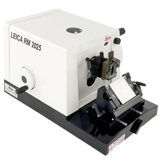 Refurbished Leica RM2025 Microtome equipment with precision blades and control panel for laboratory specimen sectioning.