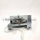 Used Leica ASP300 rotary valve assembly for repair, showing close-up of the mechanical valve part with visible fittings and components.